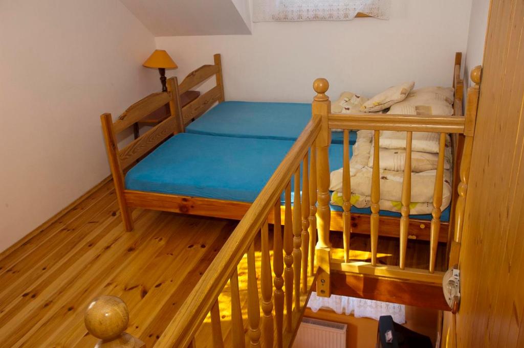 Postel nebo postele na pokoji v ubytování Apartamenty pod dębem
