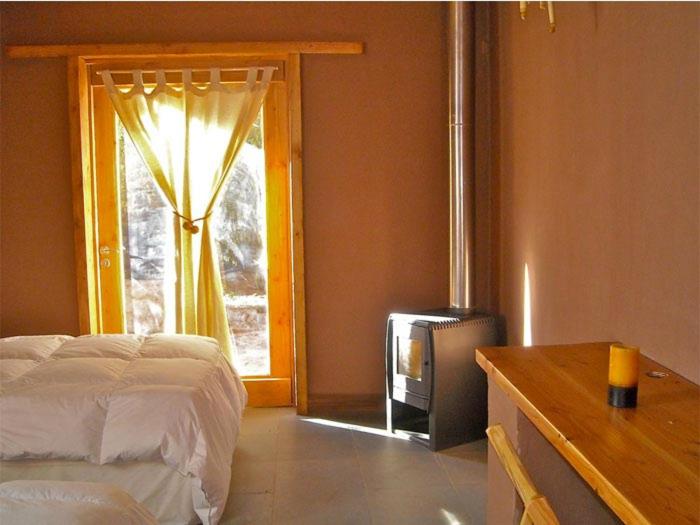Postel nebo postele na pokoji v ubytování Terra Luna Atacama