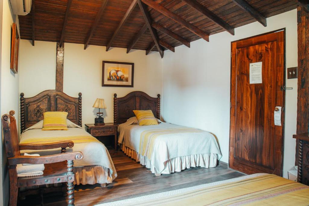 Postel nebo postele na pokoji v ubytování Hotel Antigua Miraflores