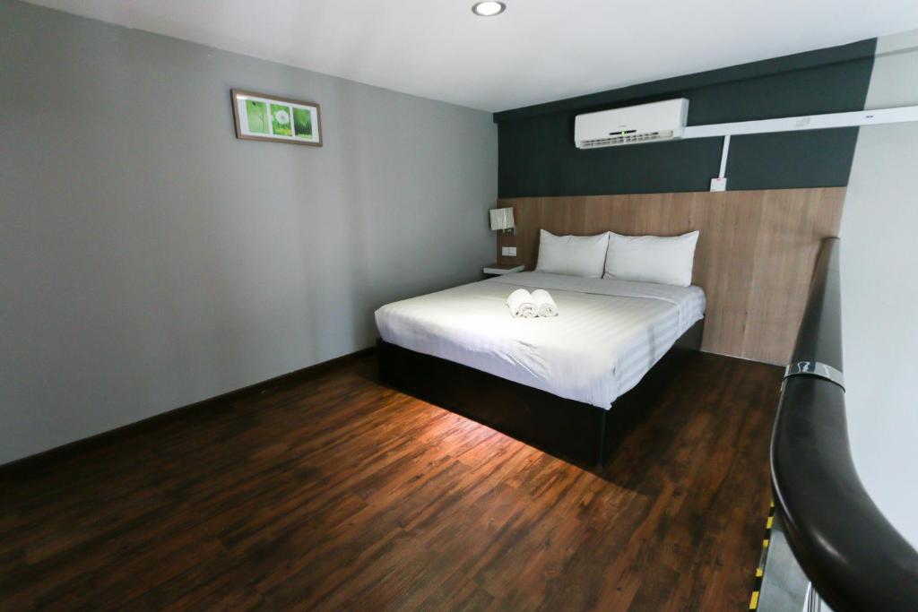 Postel nebo postele na pokoji v ubytování Hotel 99 Botanik Klang