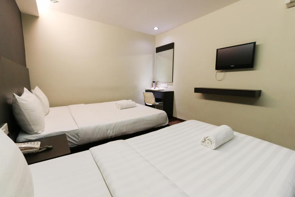 Postel nebo postele na pokoji v ubytování Hotel 99 Bandar Klang (Meru)
