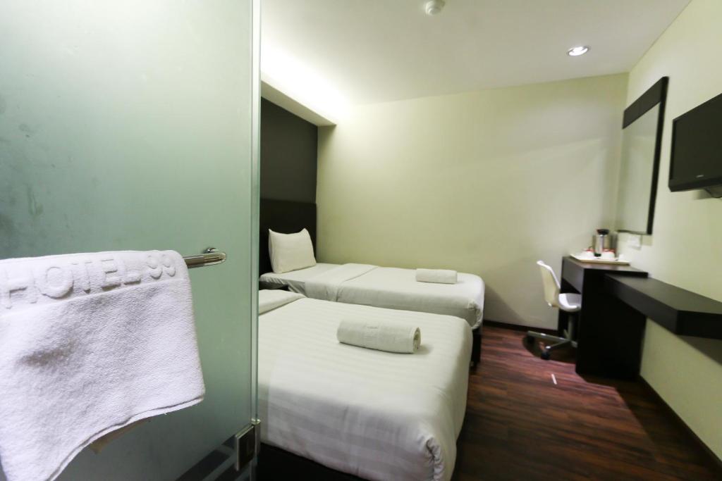 Postel nebo postele na pokoji v ubytování Hotel 99 Bandar Klang (Meru)