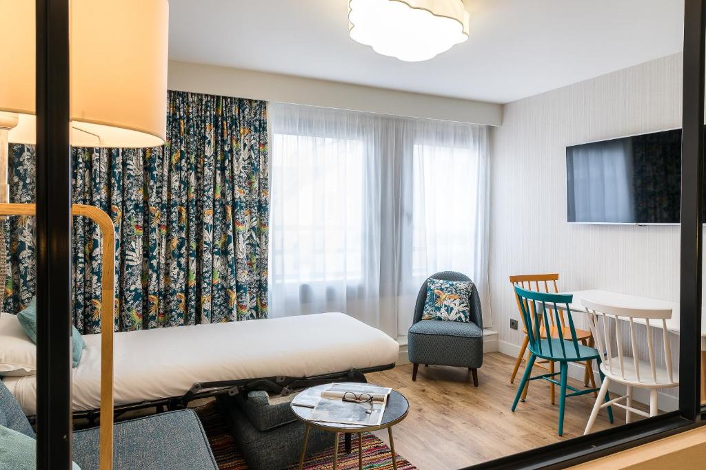 Postel nebo postele na pokoji v ubytování CADET Residence