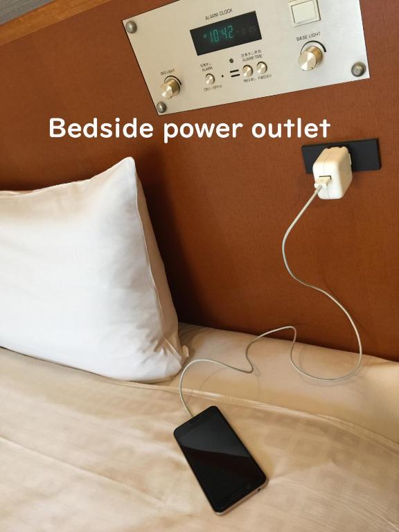 Postel nebo postele na pokoji v ubytování Sun Palace Hotel