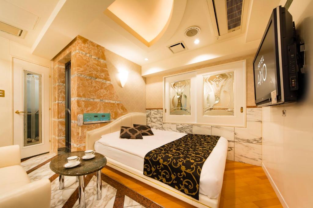 Postel nebo postele na pokoji v ubytování Hotel Apio