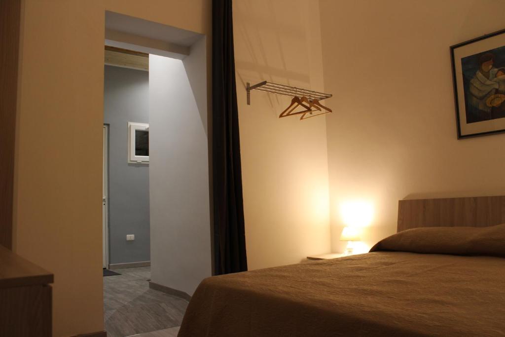 Postel nebo postele na pokoji v ubytování Domus Relax