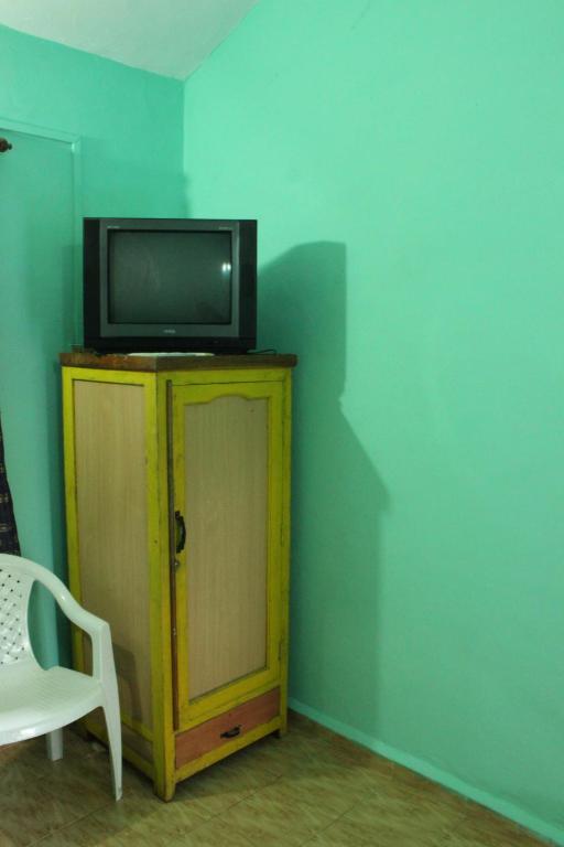 TV a/nebo společenská místnost v ubytování Pritams Cottages Guest House