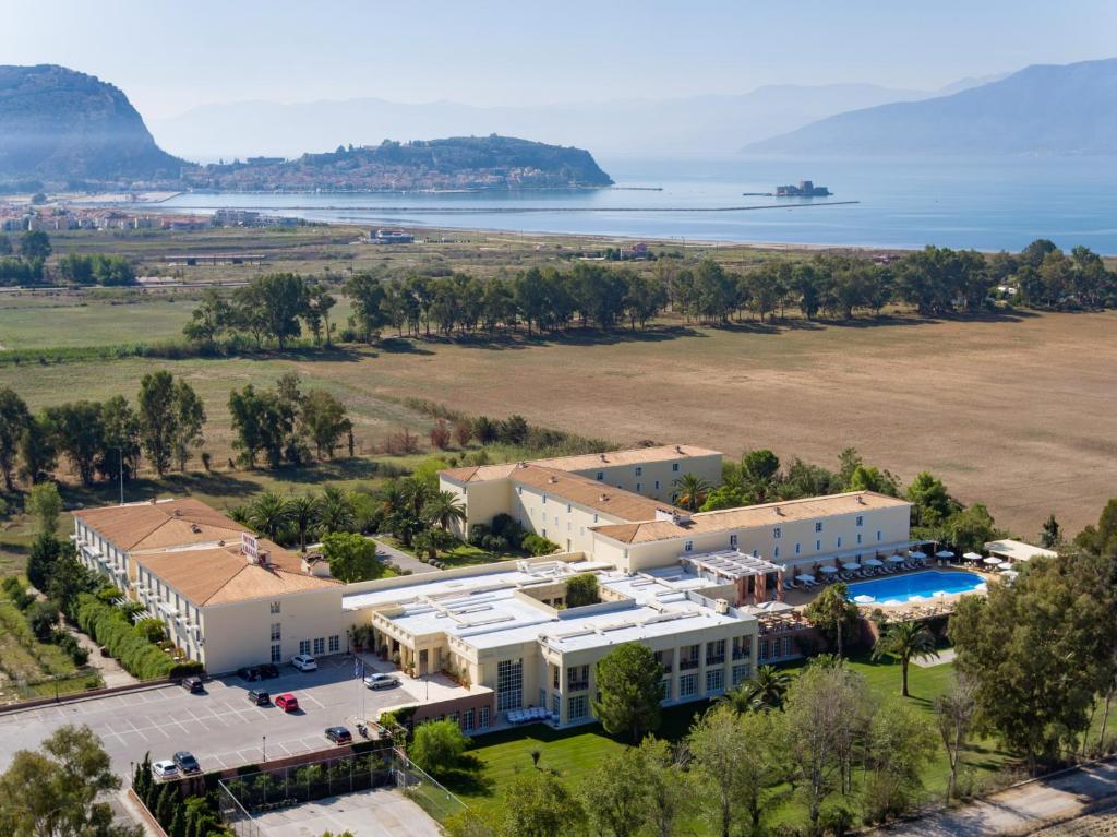 an aerial view of a large building with a pool at Amalia Hotel Nafplio in Nafplio