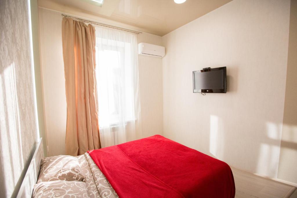 Postel nebo postele na pokoji v ubytování Sumskaya ApartHotel