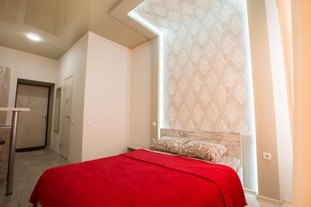 Postel nebo postele na pokoji v ubytování Sumskaya ApartHotel