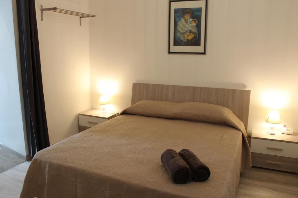 Postel nebo postele na pokoji v ubytování Domus Relax