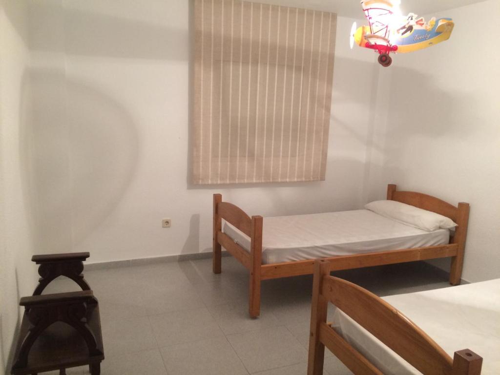Łóżko lub łóżka w pokoju w obiekcie Apartamento Elia Villa África