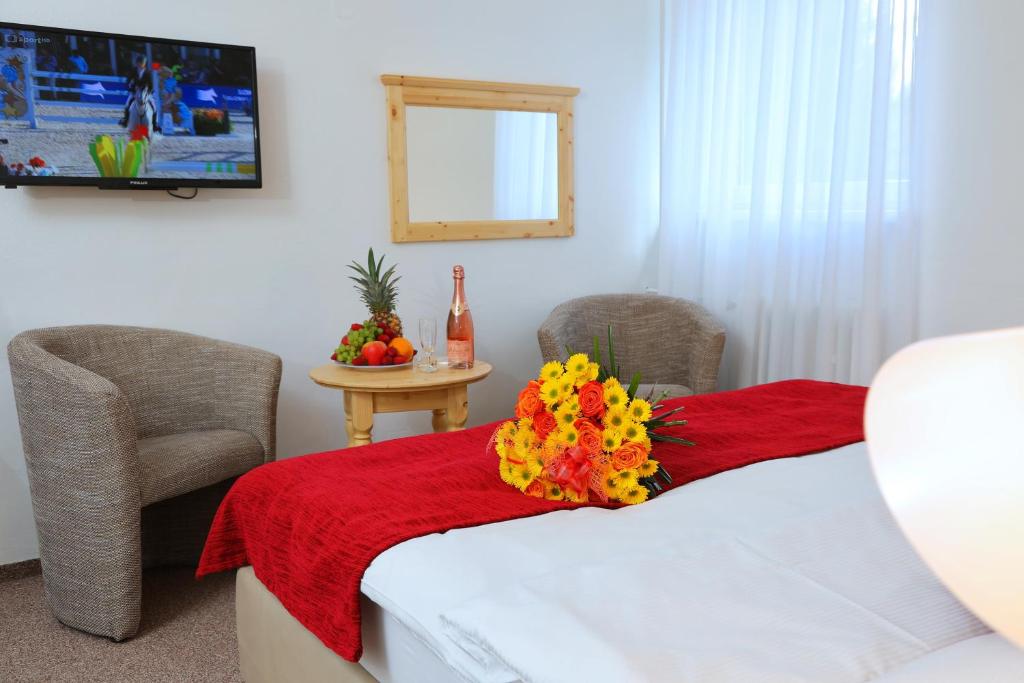 Postel nebo postele na pokoji v ubytování Hotel Lenka