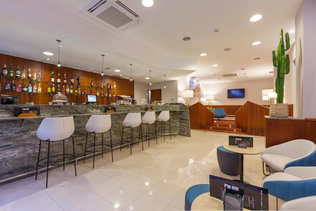 TV a/nebo společenská místnost v ubytování Hotel Delfín