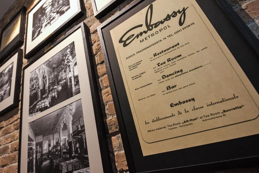 a menu for a restaurant with black and white photos at Hotel Scheuble in Zürich
