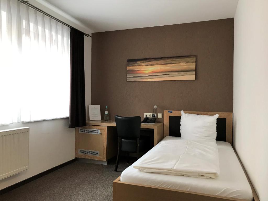 Voodi või voodid majutusasutuse Hotel Mühlhäuser Hof toas