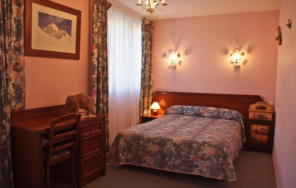 Postelja oz. postelje v sobi nastanitve Hôtel Le Catala
