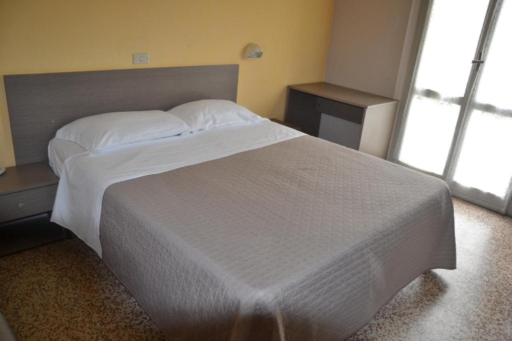 Postel nebo postele na pokoji v ubytování Hotel Britta