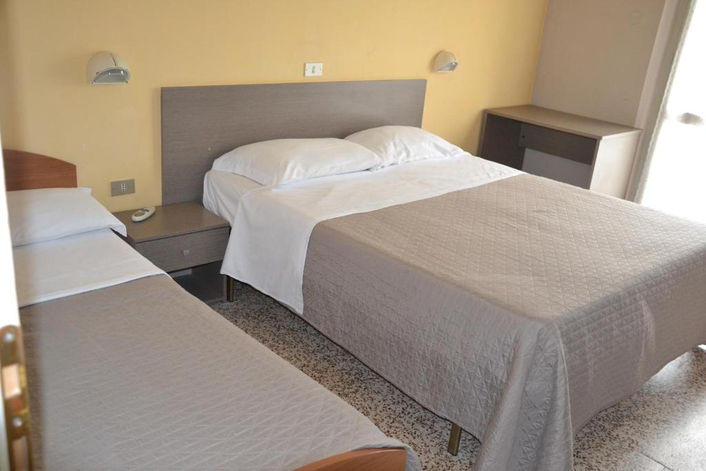 Postel nebo postele na pokoji v ubytování Hotel Britta
