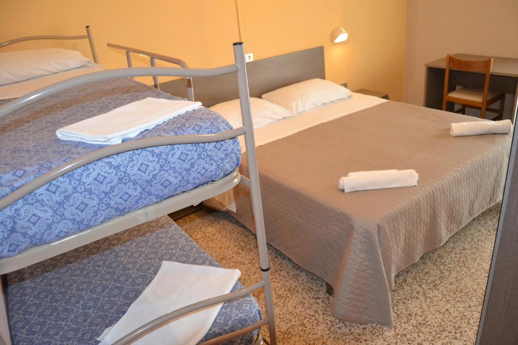 Postel nebo postele na pokoji v ubytování Hotel Britta