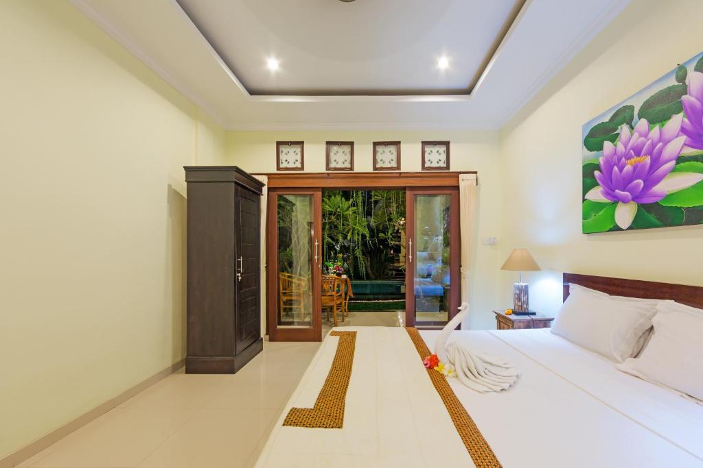 Postel nebo postele na pokoji v ubytování The Tunjung Ubud Retreat