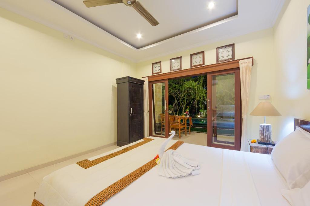 Postel nebo postele na pokoji v ubytování The Tunjung Ubud Retreat