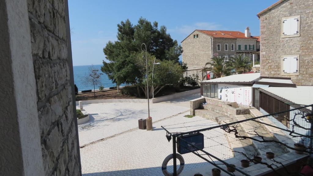 a view from the balcony of a building at Beachfront Apartments Oaza in Petrovac na Moru