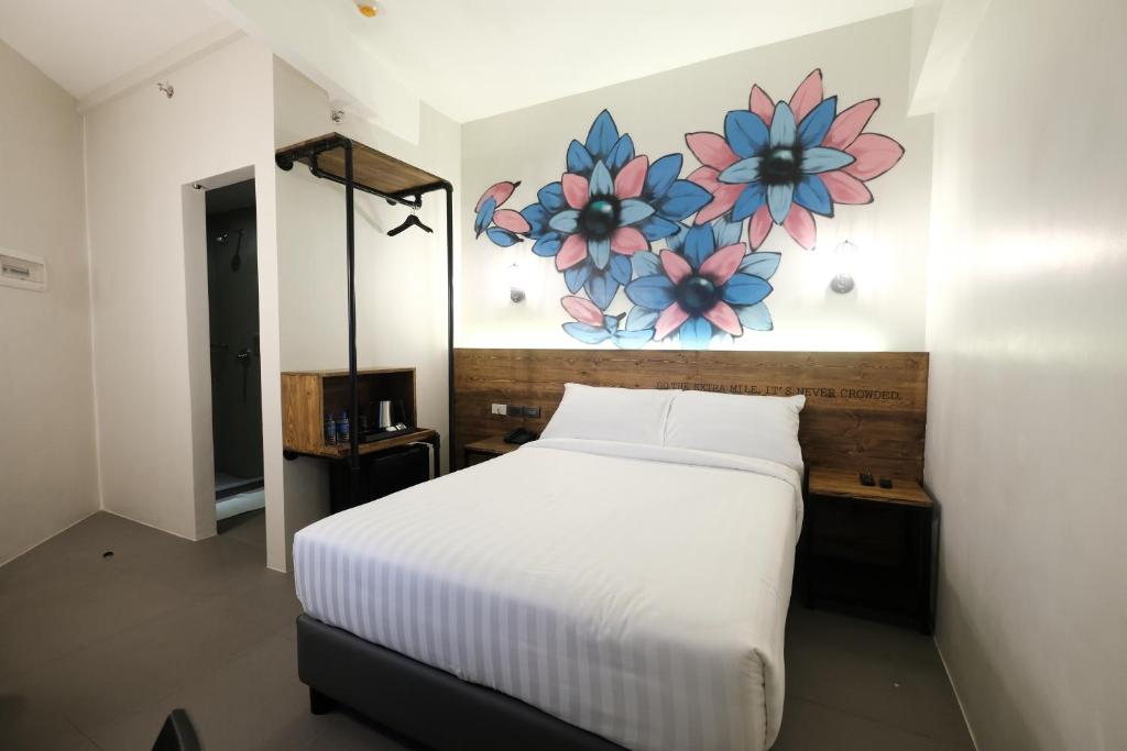 Postel nebo postele na pokoji v ubytování U Hotels Makati