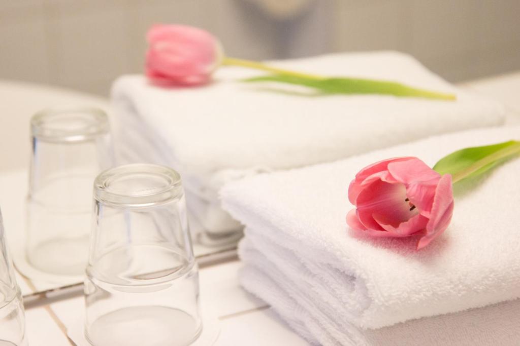 Postel nebo postele na pokoji v ubytování Hotell Aston