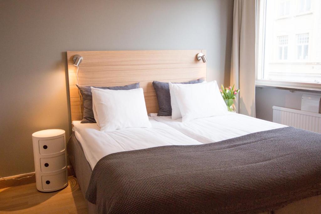 Postel nebo postele na pokoji v ubytování Hotell Aston