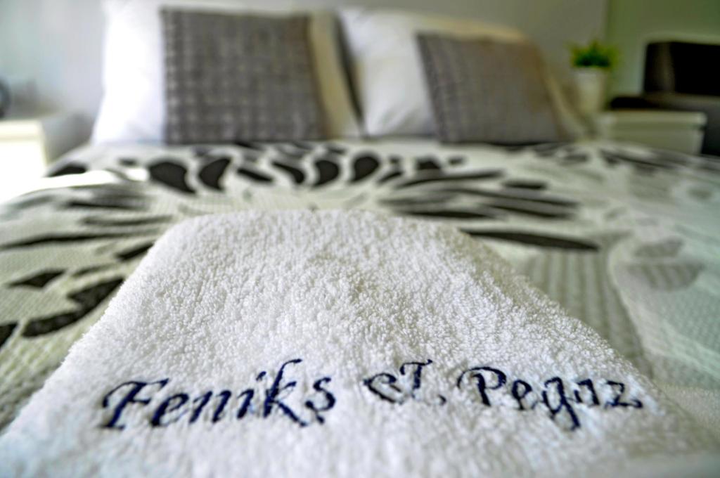 Postel nebo postele na pokoji v ubytování Apartamenty Feniks & Pegaz