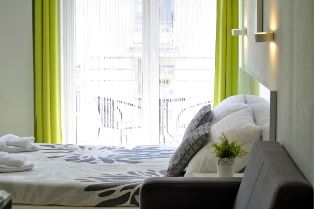 Postel nebo postele na pokoji v ubytování Apartamenty Feniks & Pegaz