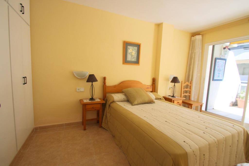 A bed or beds in a room at Villa Adriana 209