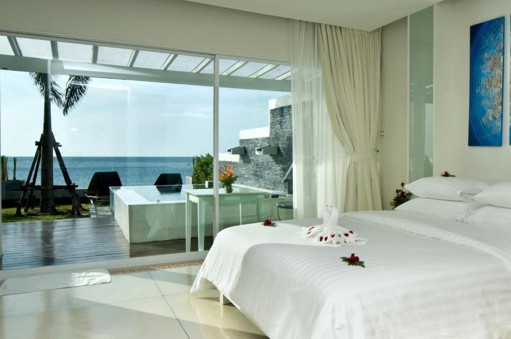Postel nebo postele na pokoji v ubytování Samui Resotel Beach Resort