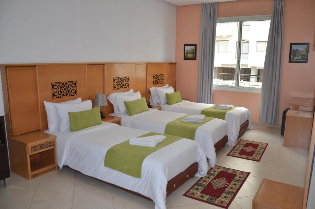 Postel nebo postele na pokoji v ubytování Hotel Miramar