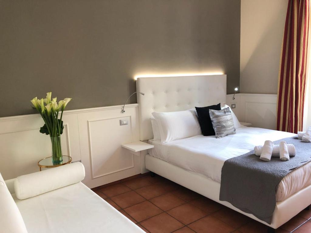 A bed or beds in a room at 207 Inn