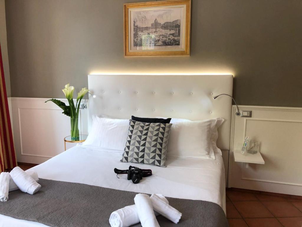 A bed or beds in a room at 207 Inn