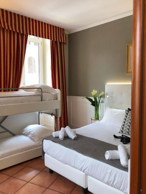 A bed or beds in a room at 207 Inn