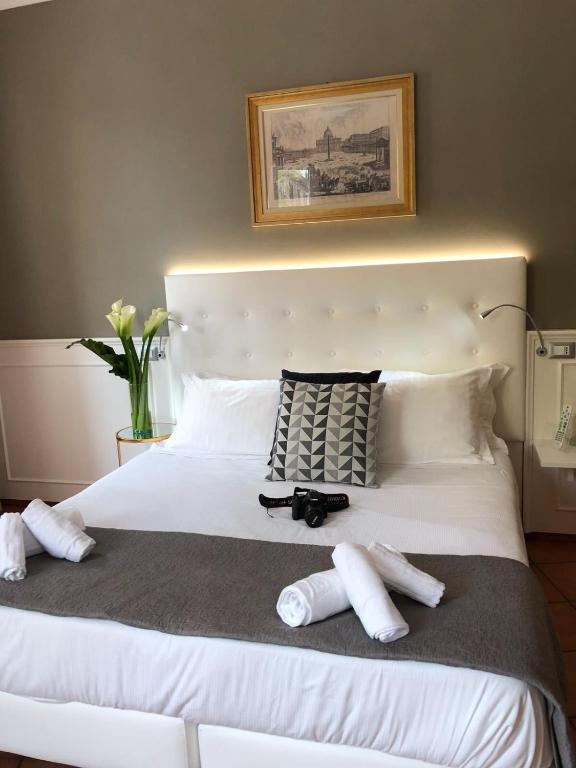 A bed or beds in a room at 207 Inn