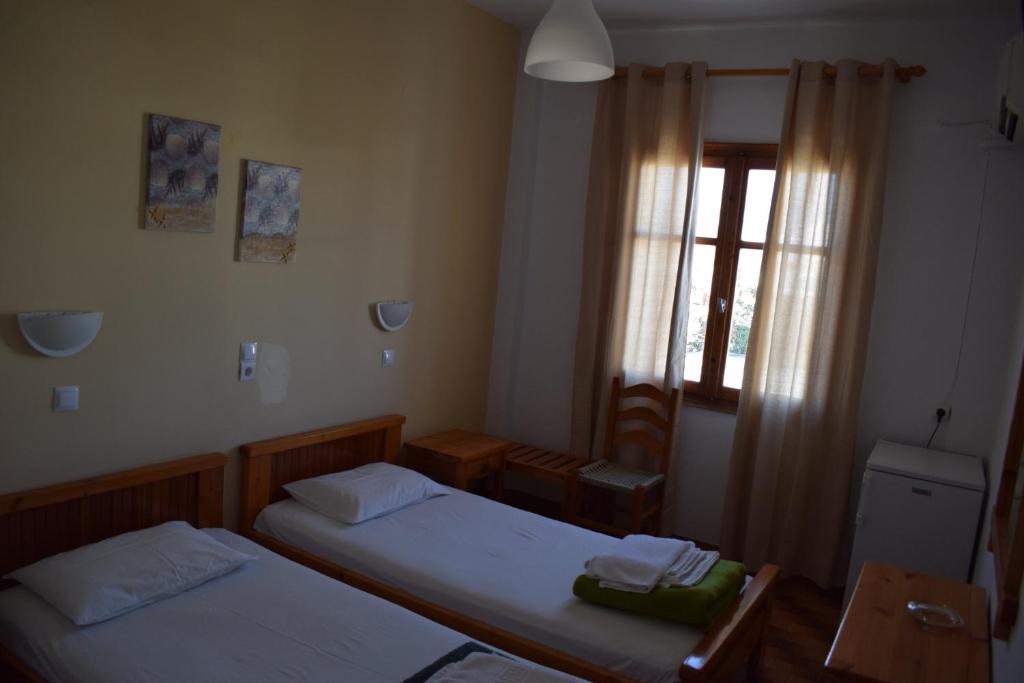Posteľ alebo postele v izbe v ubytovaní Aratos Hotel