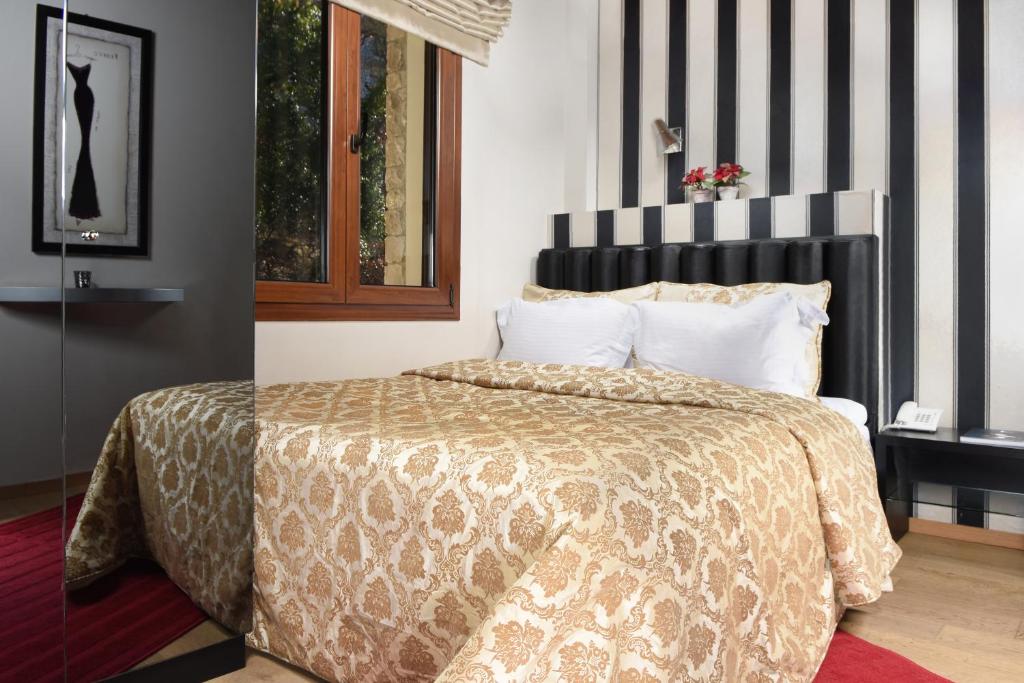 Postel nebo postele na pokoji v ubytování Forest Suites Boutique Hotel