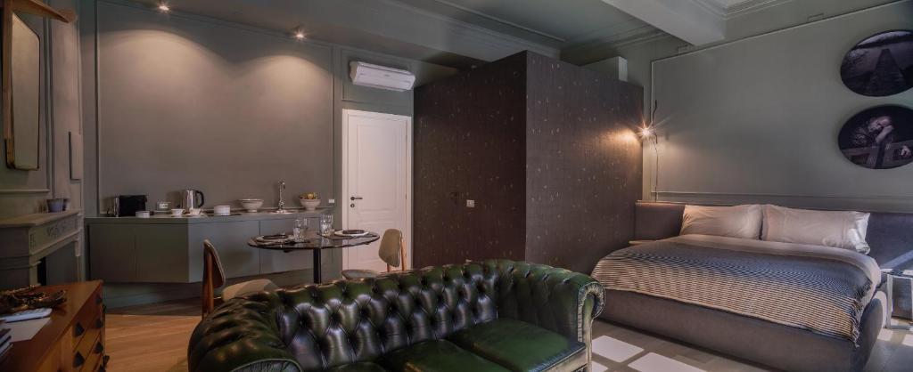 a living room with a couch and a table at Suites Menaggio in Menaggio