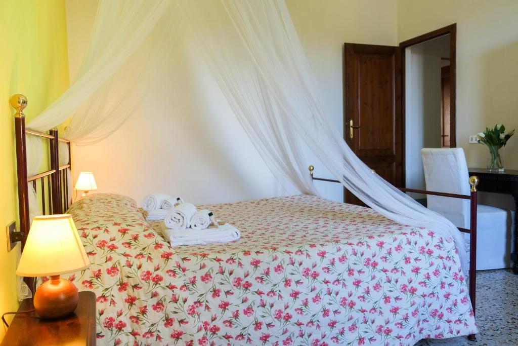 Postel nebo postele na pokoji v ubytování Borgo Poneta