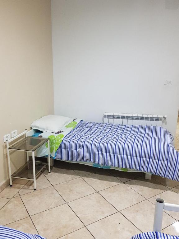 Una cama o camas en una habitación de Hotel Afef