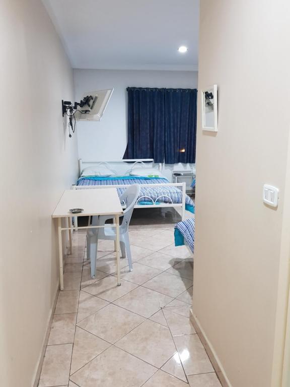 Una cama o camas en una habitación de Hotel Afef
