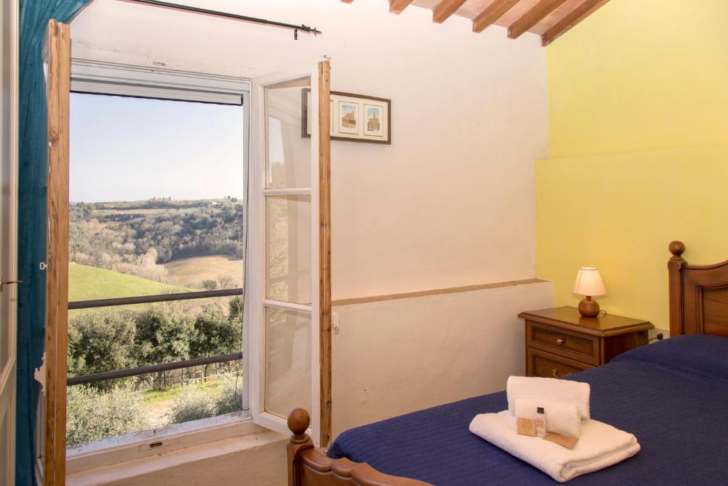 Postel nebo postele na pokoji v ubytování Borgo Poneta