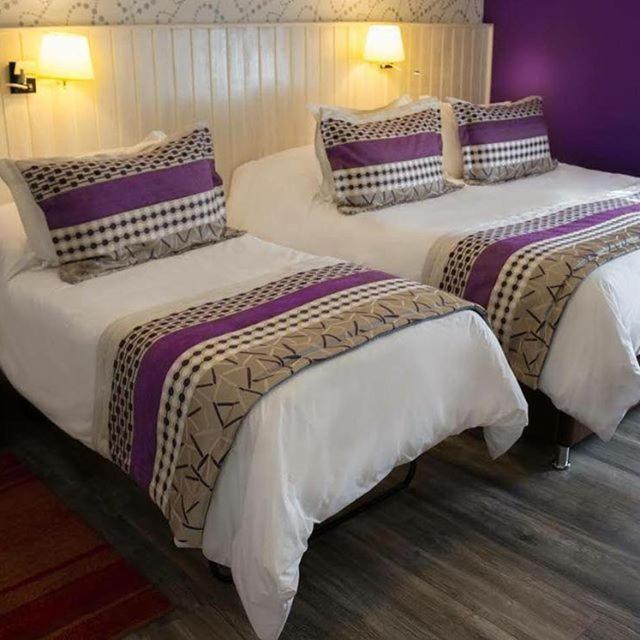 Postel nebo postele na pokoji v ubytování LV Hoteles Boutique