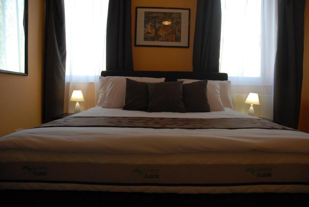 Posteľ alebo postele v izbe v ubytovaní Joy Guesthouse