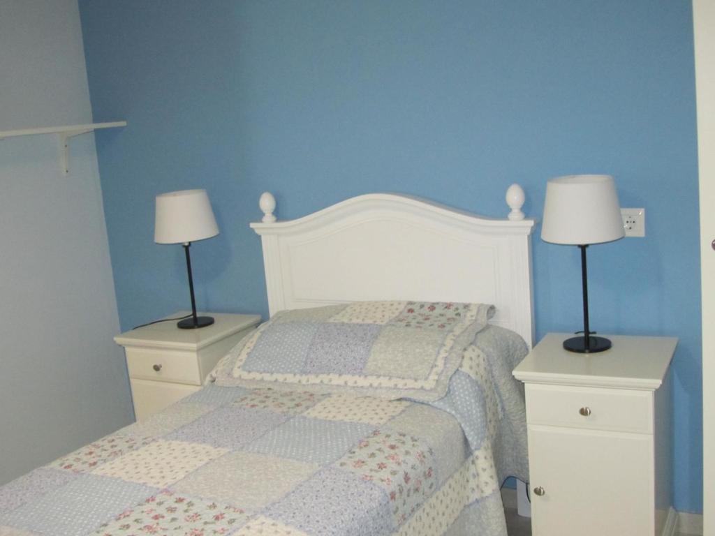 Postel nebo postele na pokoji v ubytování Apartamentos El Majuelo
