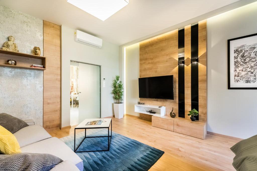 Televízia a/alebo spoločenská miestnosť v ubytovaní BpR Pixies Design Home